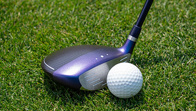 G Le4 fairway addressing ball in grass