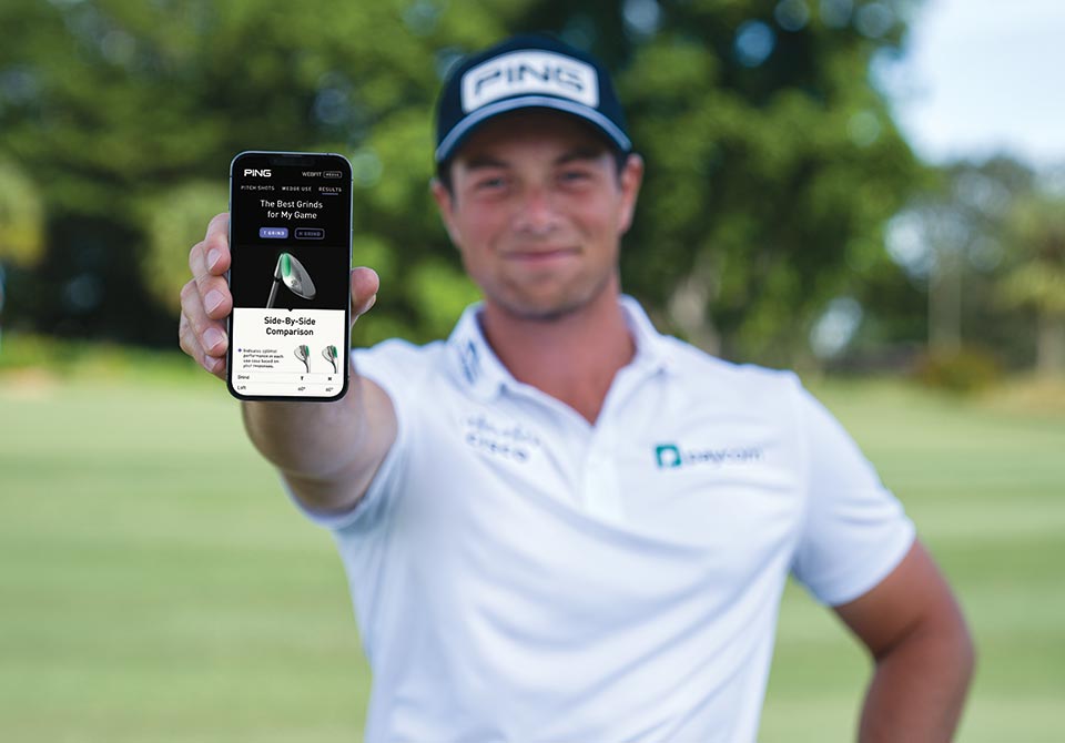 PING pro Viktor Hovland with the WebFit Wedge app on a phone